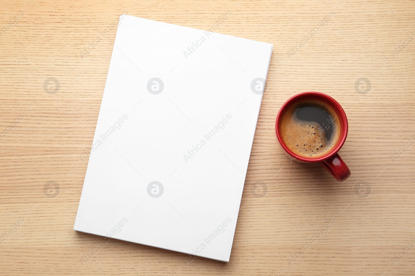 Photo of Blank paper sheets for brochure and cup of coffee on wooden background, flat lay. Mock up