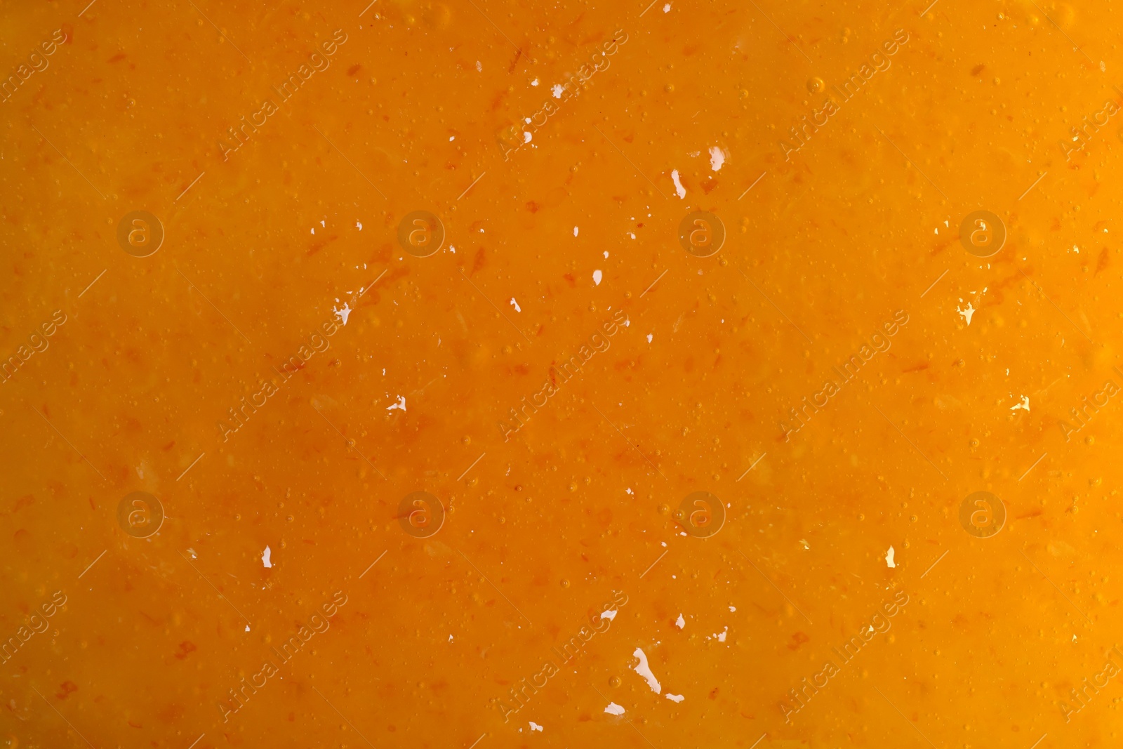 Image of Sweet apricot jam as background, closeup view