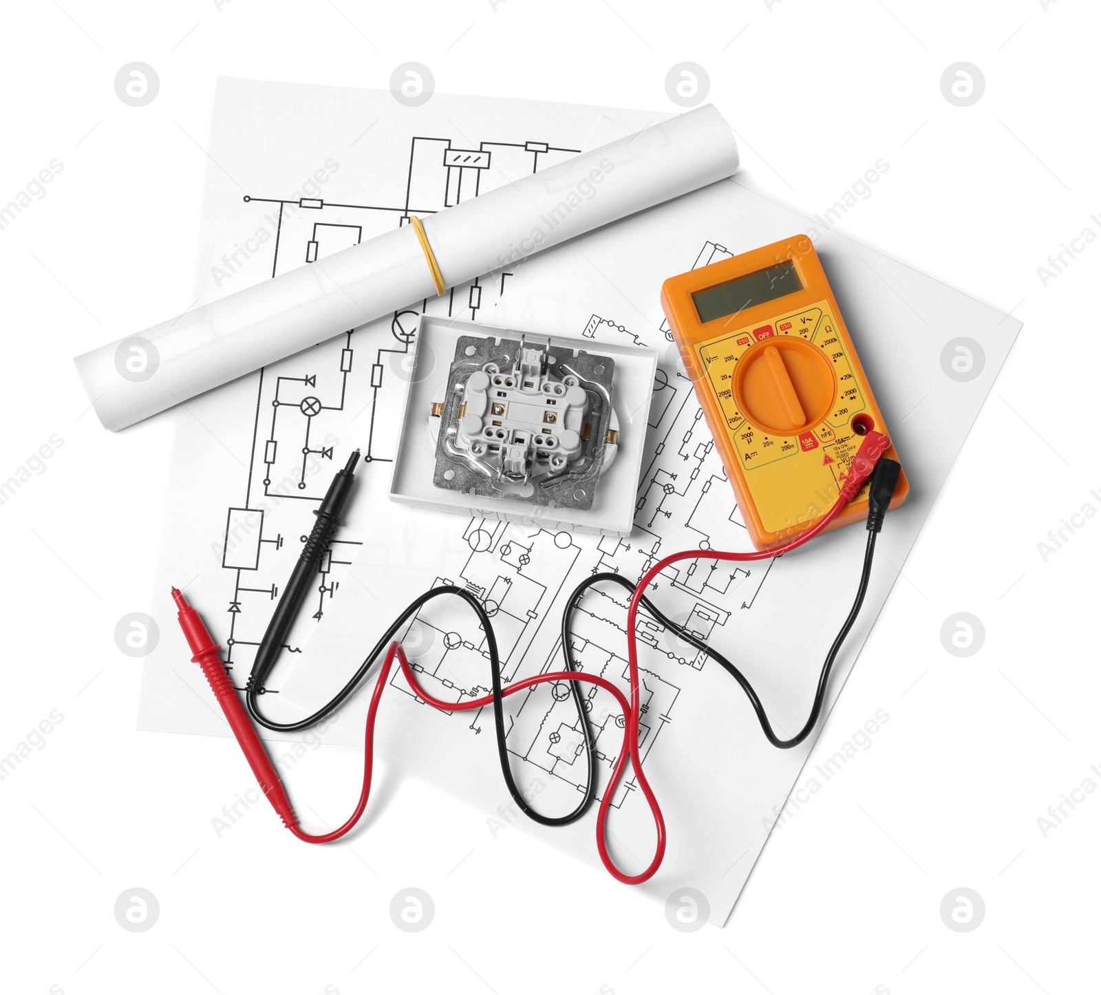 Photo of Wiring diagrams, digital multimeter and disassembled light switch isolated on white, top view