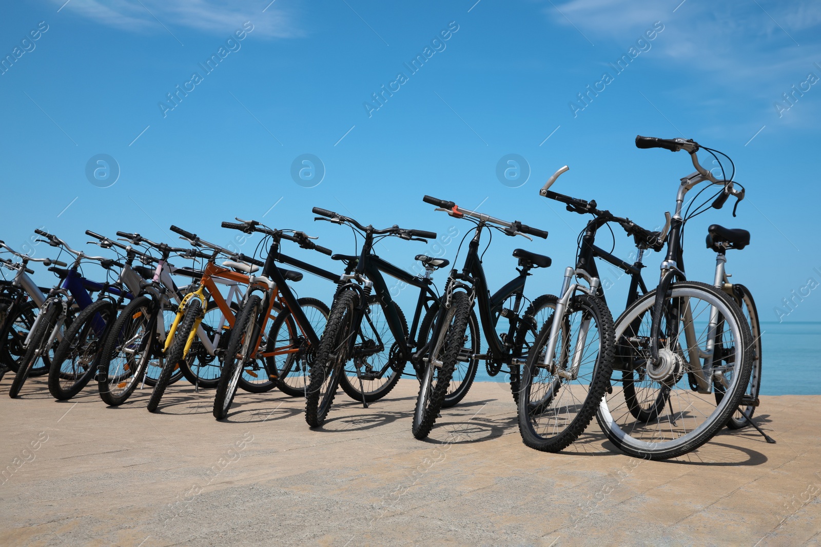 Photo of Parking with bicycles on embankment near sea