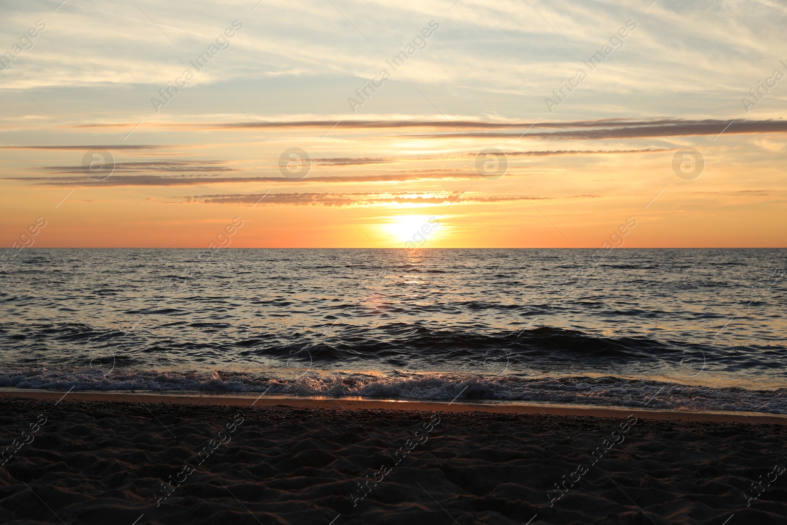 Photo of Picturesque view of sea at sunset. Tropical beach