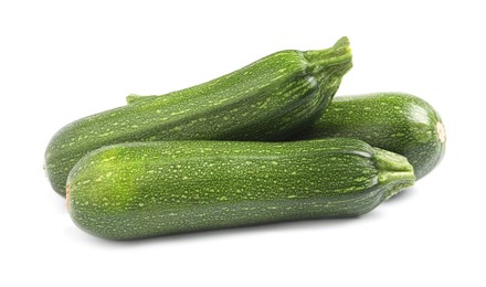 Photo of Fresh raw ripe zucchinis on white background