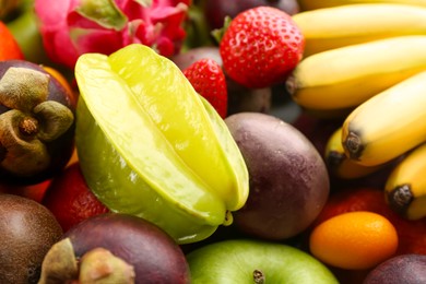 Photo of Assortment of fresh exotic fruits as background, closeup