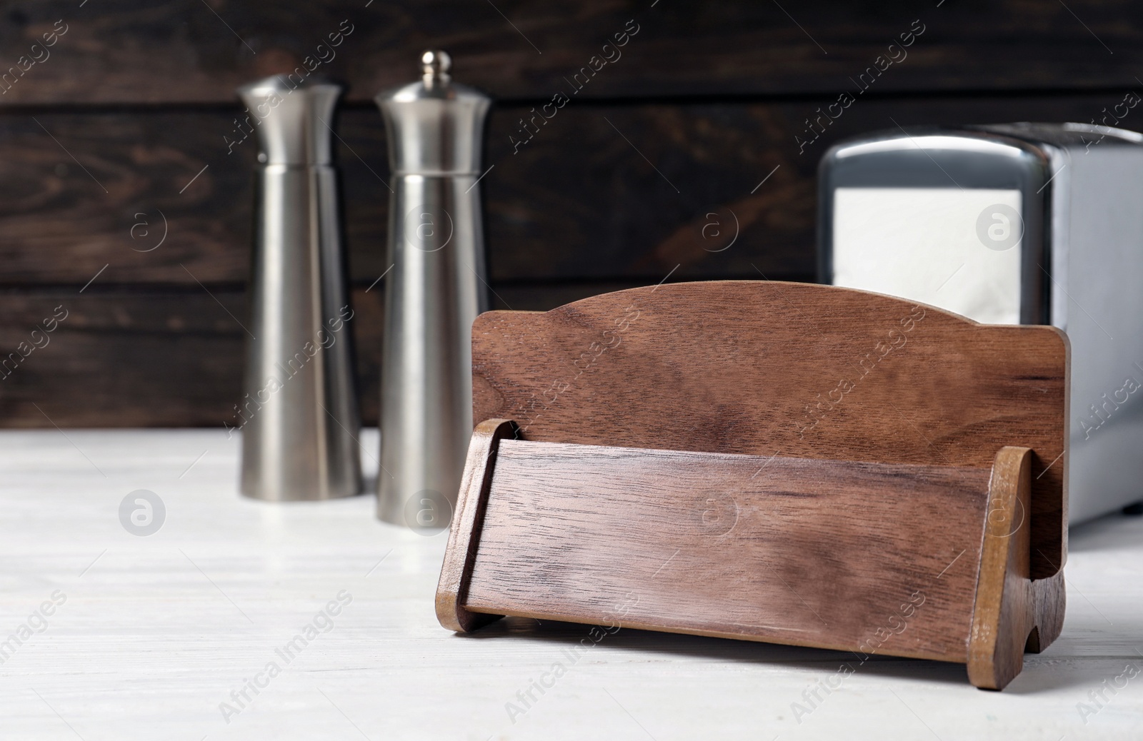 Photo of Wooden sign RESERVED on table in restaurant