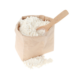 Photo of Organic flour and spoon in paper bag isolated on white