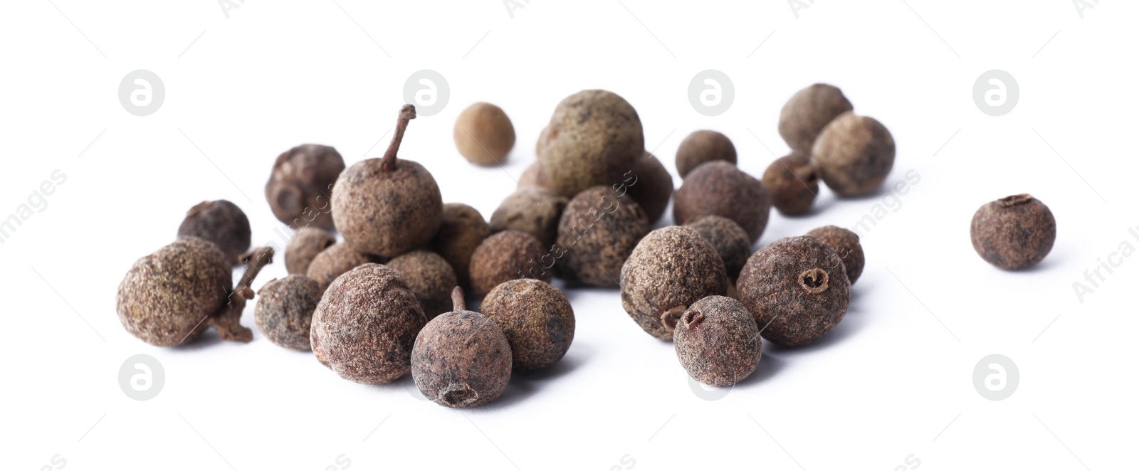 Photo of Heap of black pepper grains isolated on white