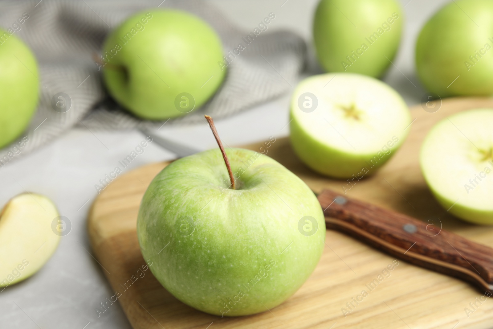 Photo of Composition with fresh ripe green apples on grey table, space for text