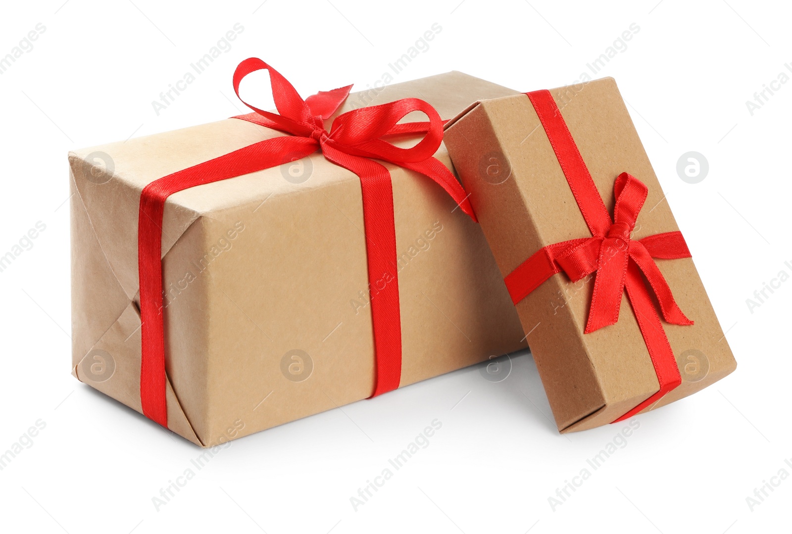 Photo of Christmas gift boxes decorated with red bows on white background