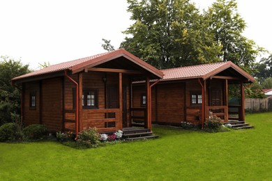 Beautiful wooden beach houses and green trees outdoors