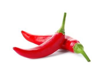 Photo of Red hot chili peppers on white background