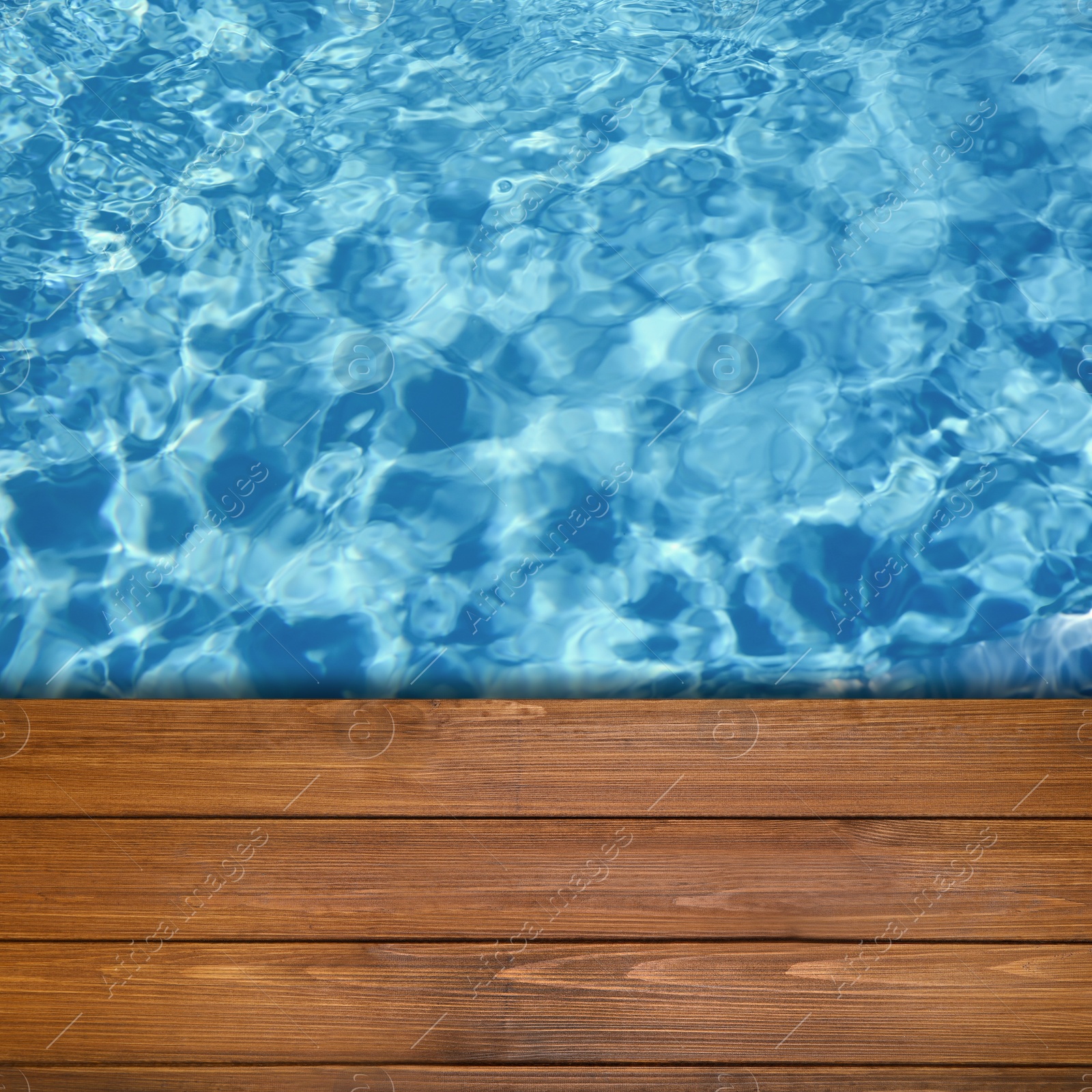 Image of Empty blue wooden surface near swimming pool with clear water. Space for design