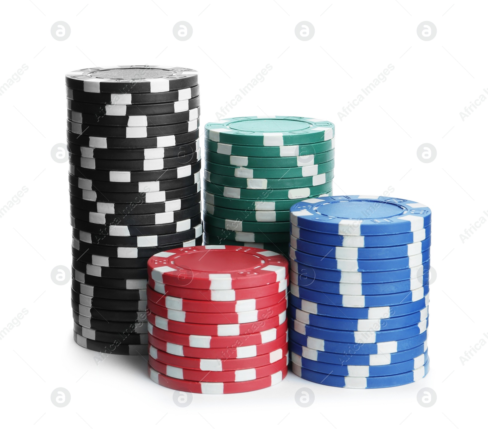 Photo of Plastic casino chips stacked on white background. Poker game