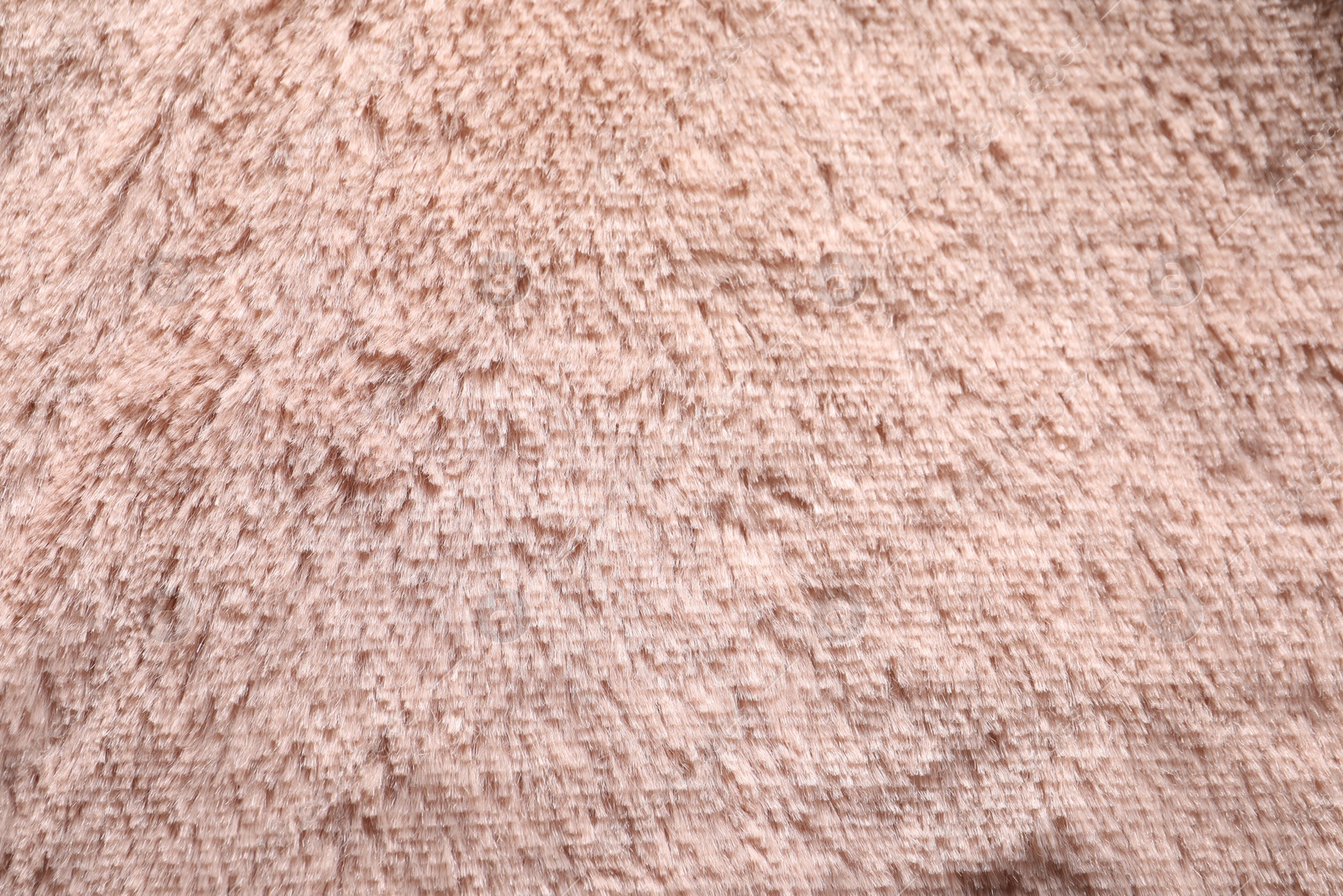 Photo of Texture of pink faux fur as background, closeup