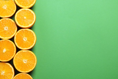 Photo of Flat lay composition with ripe oranges and space for text on color background