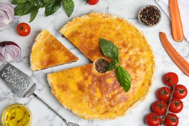 Photo of Delicious pie with minced meat and ingredients on white marble table, flat lay