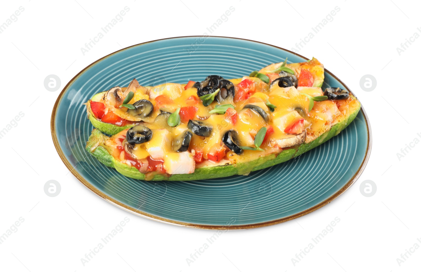 Photo of Plate of baked stuffed zucchinis on white background