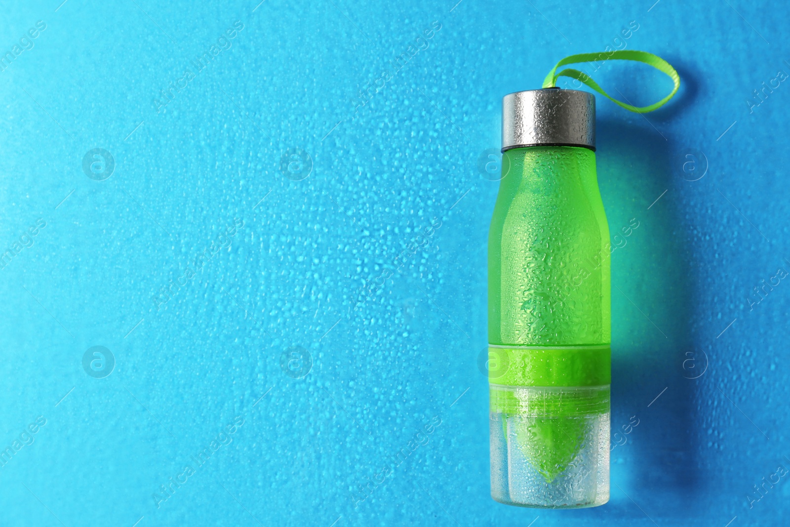 Photo of Sports water bottle on color background. Space for text