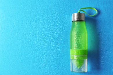 Photo of Sports water bottle on color background. Space for text