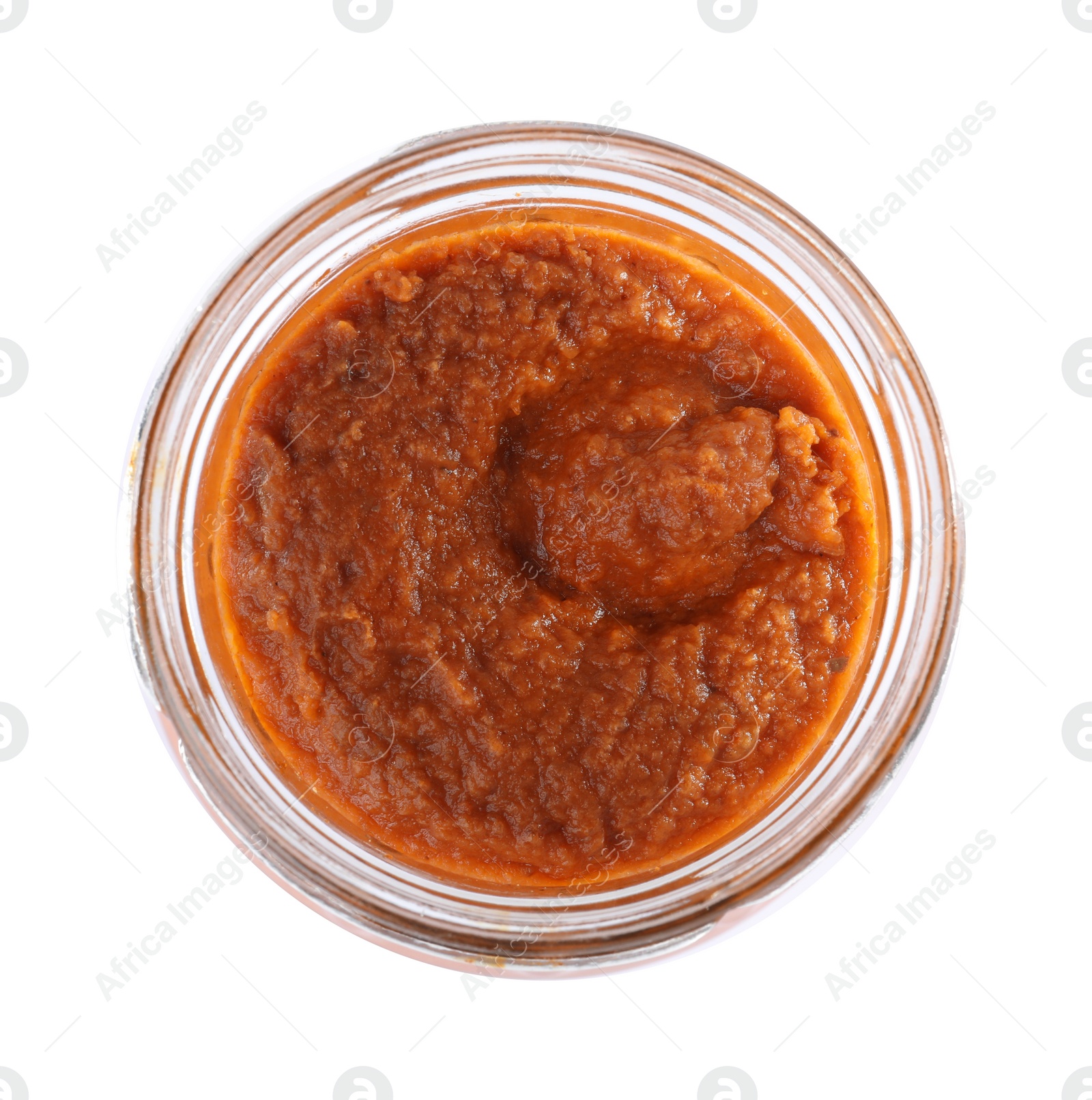 Photo of Open jar with butternut squash spread on white background, top view. Pickled food