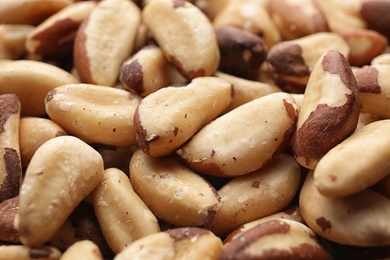 Photo of Many delicious Brazil nuts as background, closeup