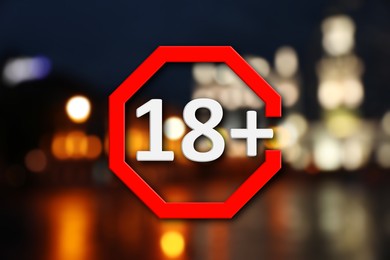 Image of Age limit sign 18+ years and blurred view of night city