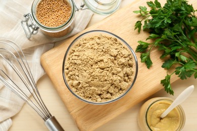 Photo of Flat lay composition with aromatic mustard powder, seeds and parsley on wooden table