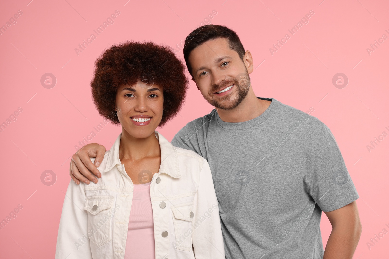 Photo of International dating. Portrait of happy couple on pink background