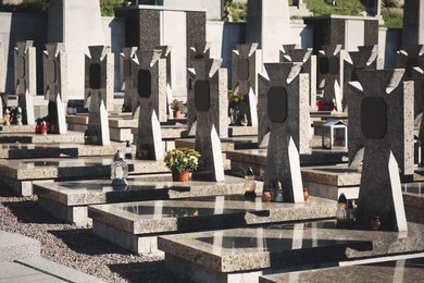 Photo of Many granite tombstones at cemetery. Religious tradition