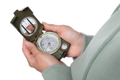 Photo of Woman holding compass on white background, closeup