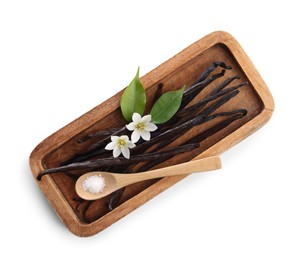 Photo of Vanilla pods, flowers, leaves and spoon with sugar isolated on white, top view