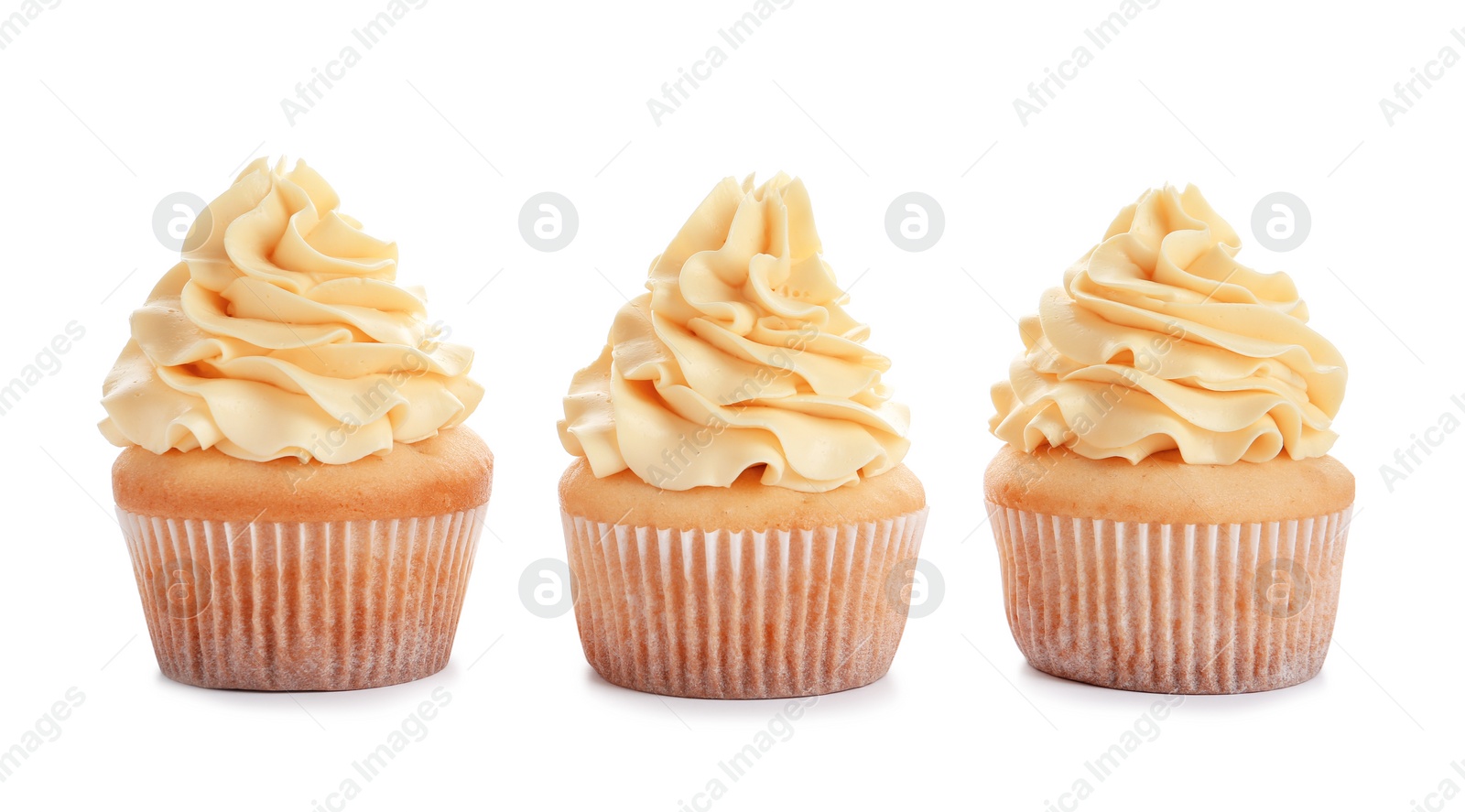 Photo of Delicious cupcakes with cream on white background