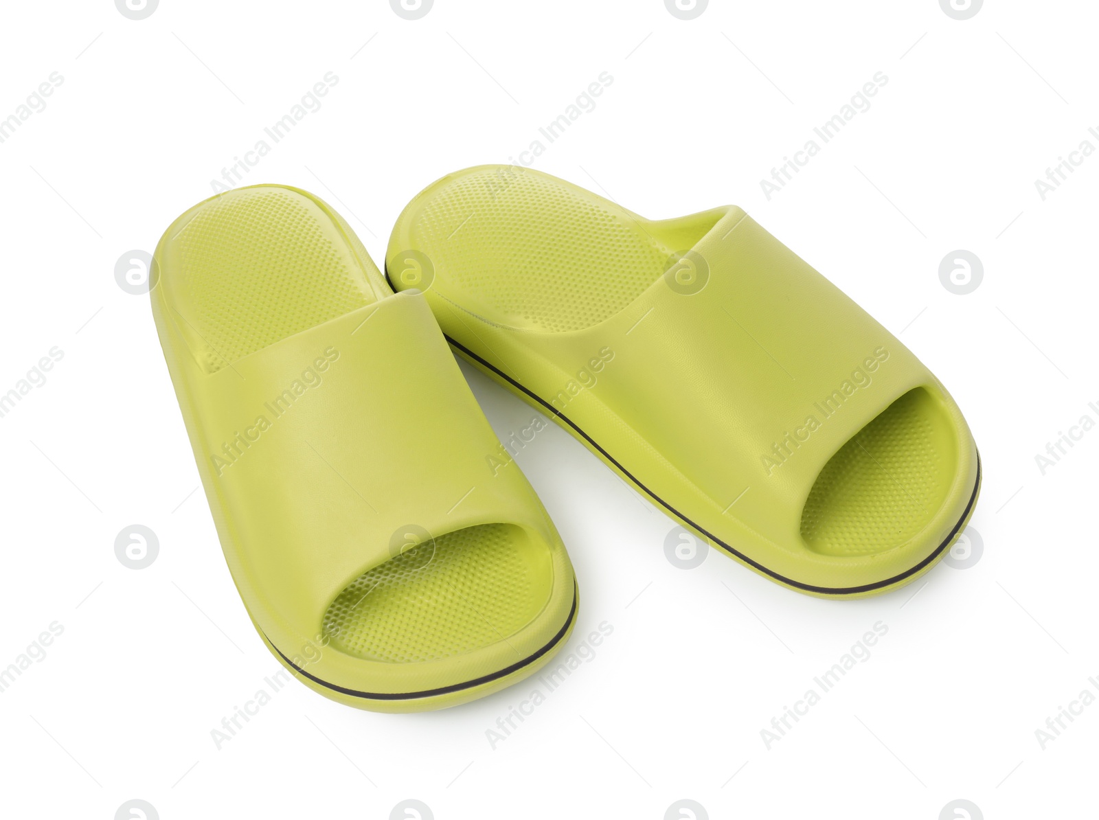 Photo of Pair of green rubber slippers isolated on white