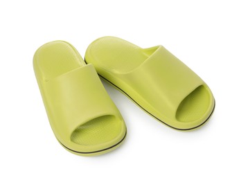 Photo of Pair of green rubber slippers isolated on white