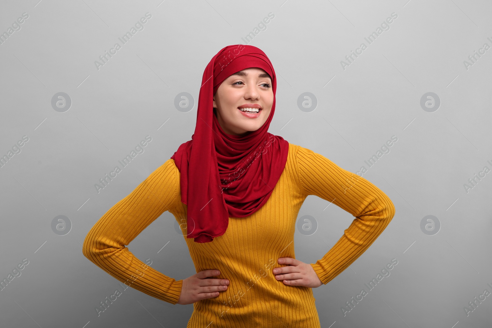 Photo of Portrait of Muslim woman in hijab on light gray background