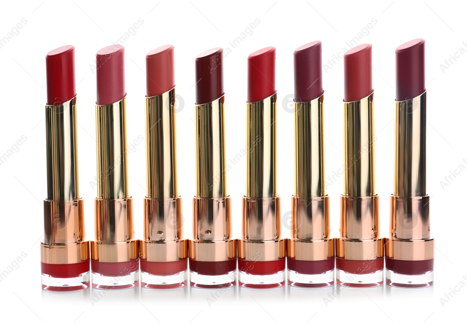 Photo of Many different stylish lipsticks on white background