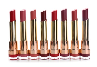 Photo of Many different stylish lipsticks on white background