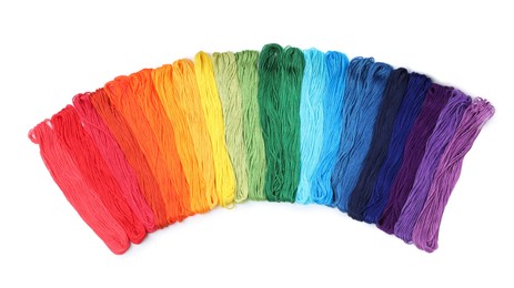 Photo of Set of colorful embroidery threads on white background, top view