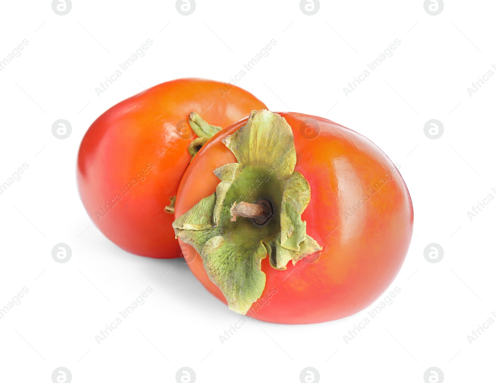 Photo of Delicious fresh ripe persimmons isolated on white