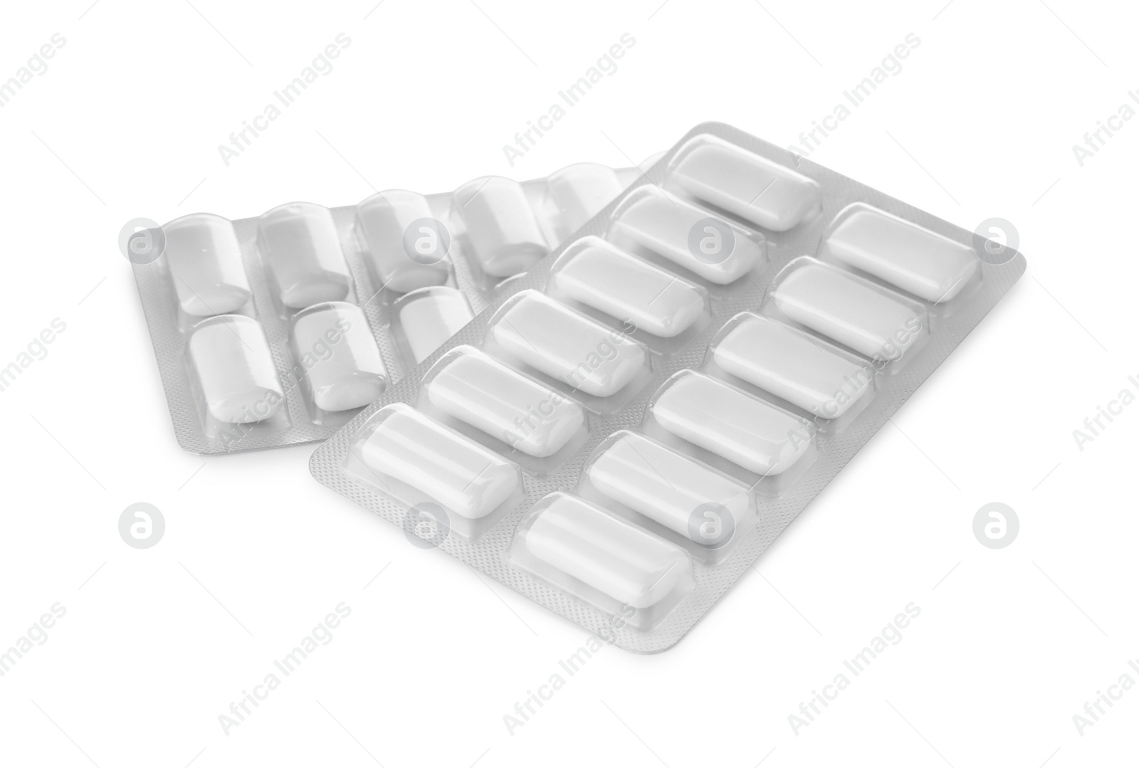 Photo of Blisters with chewing gums on white background