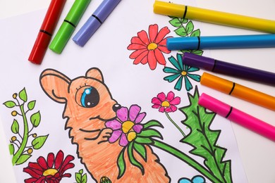 Photo of Child's colored drawing with felt tip pens, flat lay