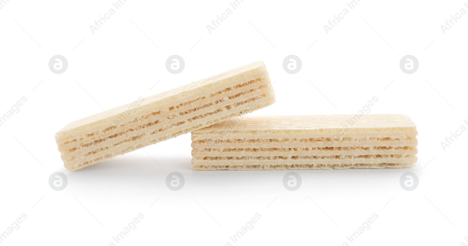 Photo of Delicious crispy wafers on white background. Sweet food