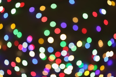 Photo of Beautiful colorful lights on dark background. Bokeh effect