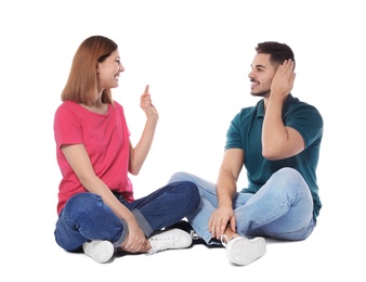 Photo of Hearing impaired friends using sign language for communication isolated on white