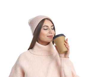 Happy beautiful woman with paper cup of mulled wine on white background