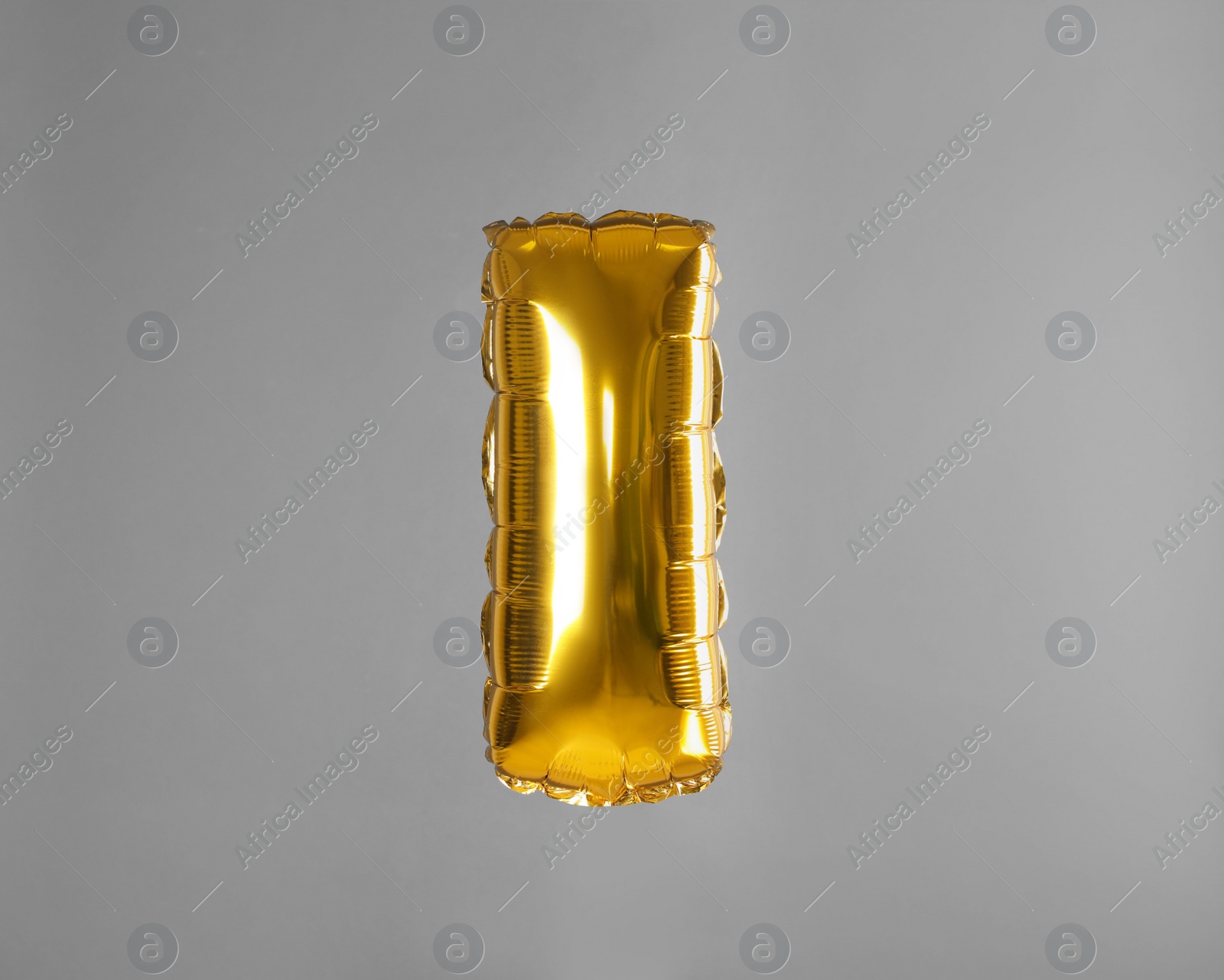 Photo of Golden letter I balloon on grey background