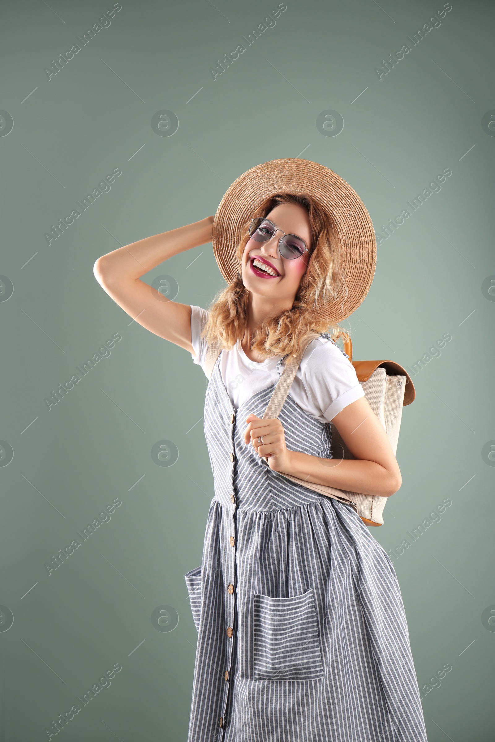 Photo of Beautiful young woman posing on color background. Summer fashion