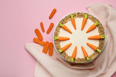 Photo of Flat lay composition with tasty carrot cake on pink background, space for text