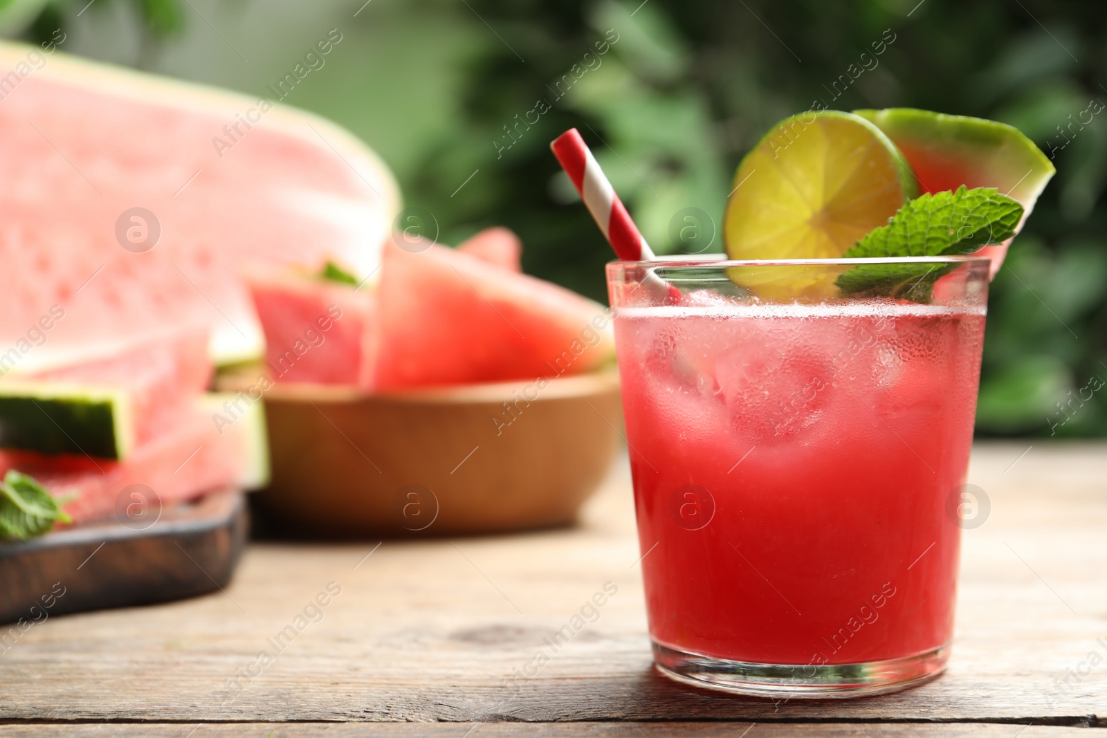 Photo of Delicious fresh watermelon drink on wooden table