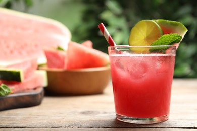 Photo of Delicious fresh watermelon drink on wooden table