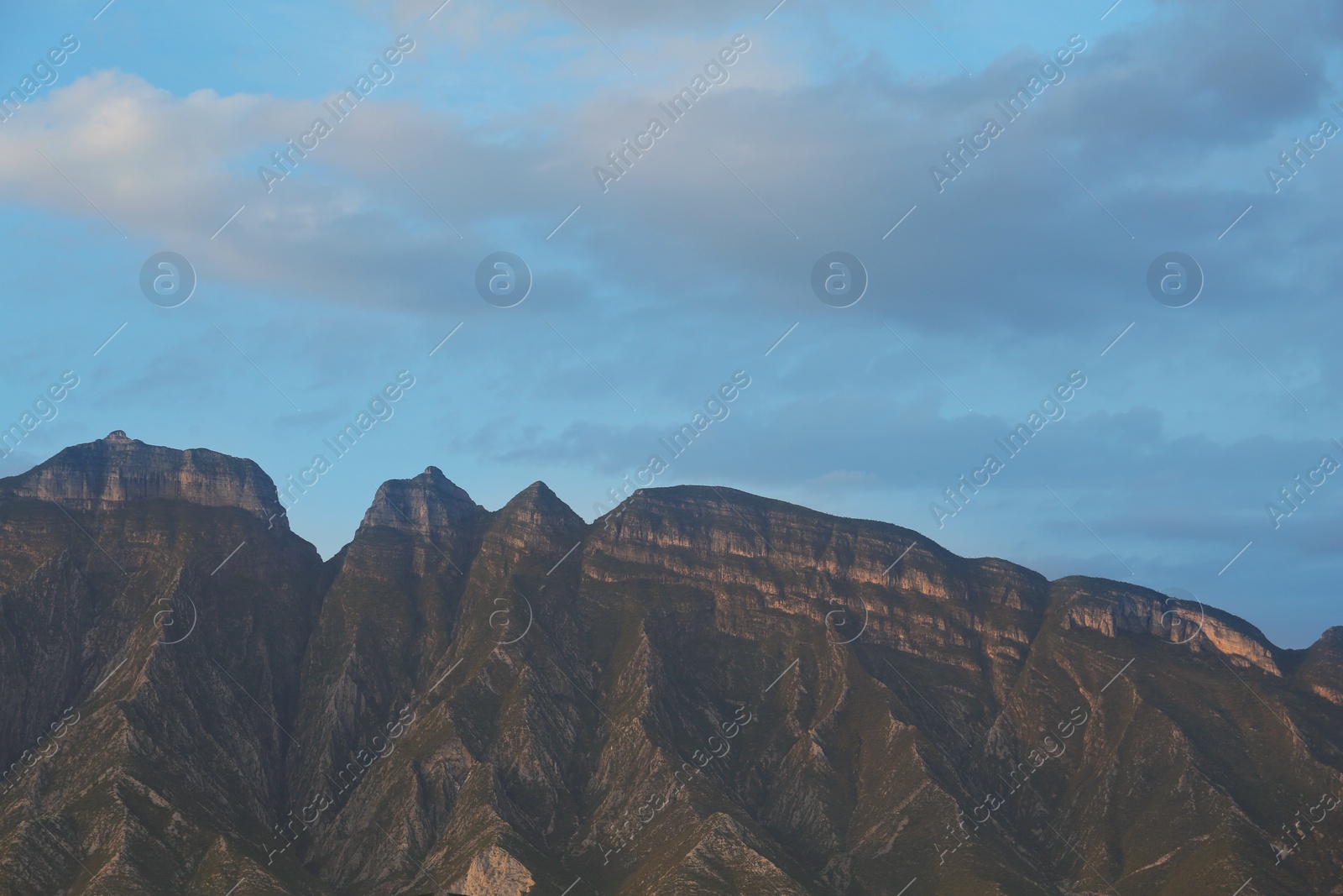 Photo of Picturesque view of beautiful mountains and sunset sky